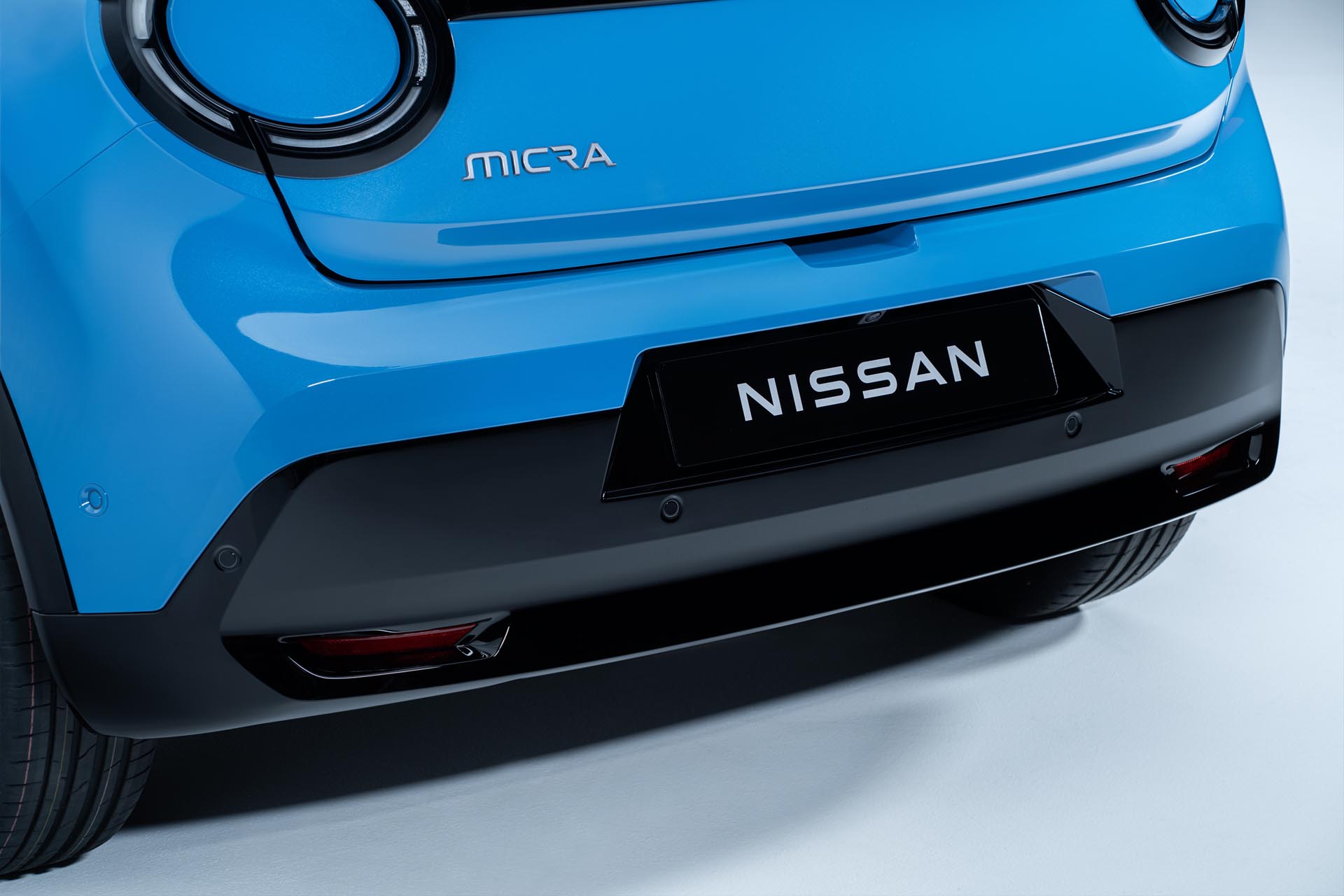detailed image of Micra bumper with Micra badge and Nissan name plate