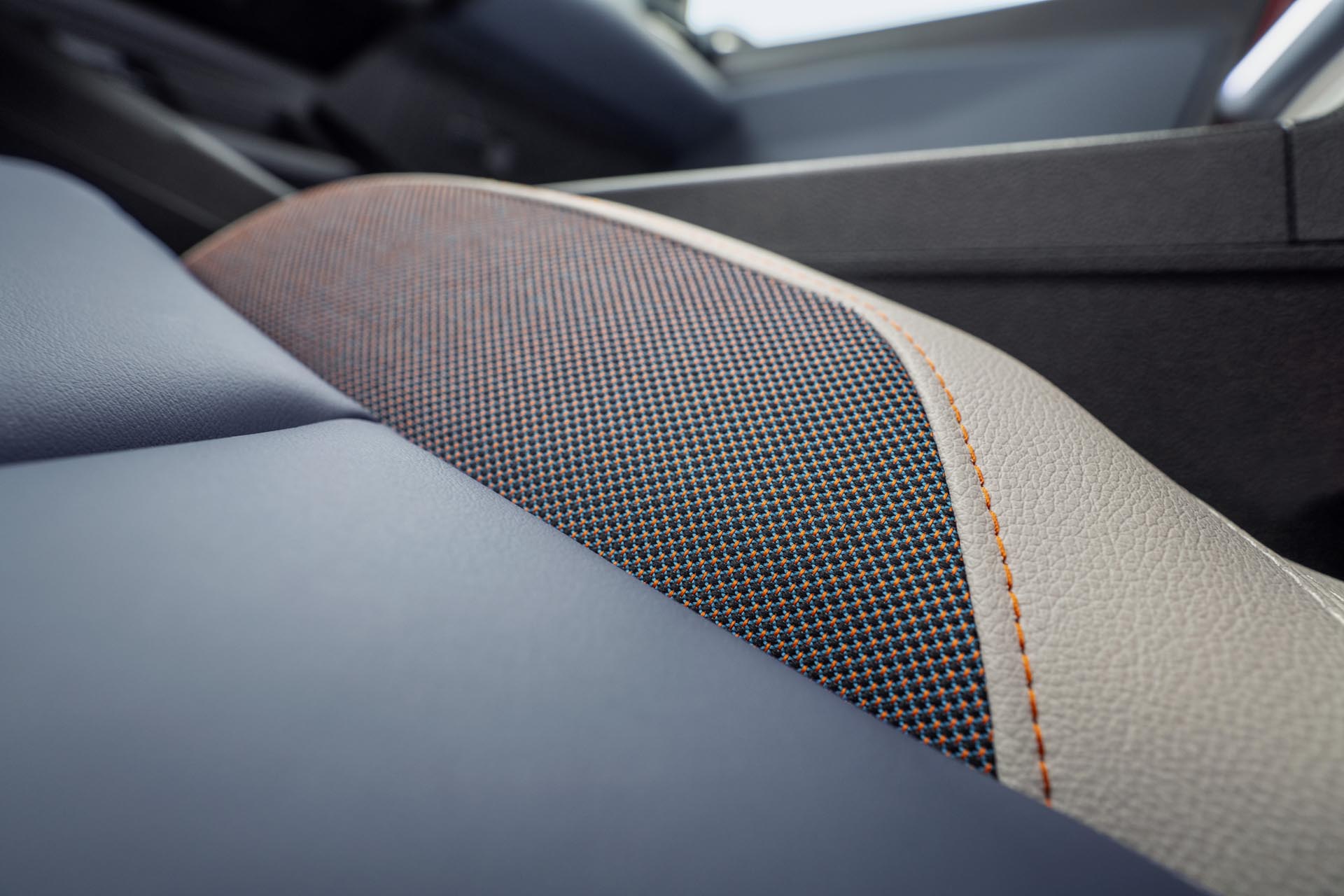 detailed shot of Micra seat leather materials with orange stitching